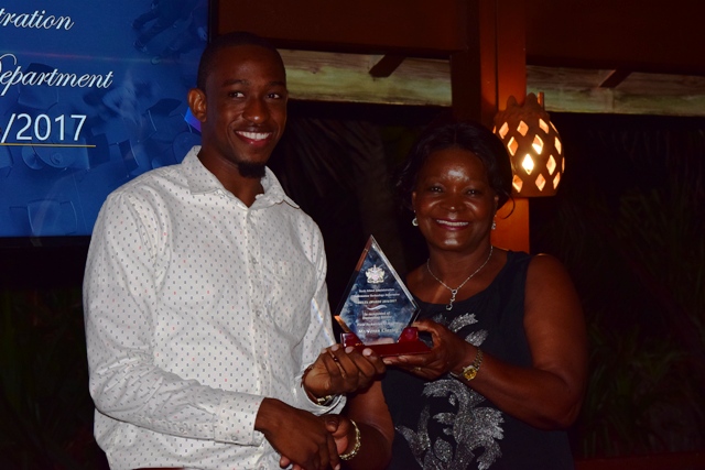 Jevon Claxton receiving the Field Technician of the Year Award from Mrs. Verni Amory, wife of the Premier of Nevis Hon. Vance Amory, at the 2nd Annual Information Technology Department Delta Awards Dinner at the Nisbet Plantation Beach Hotel on February 18, 2017